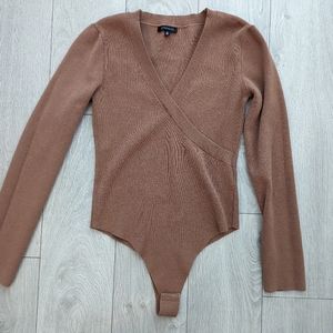 Like new dynamite knit wrap bodysuit size Medium, camel colour.